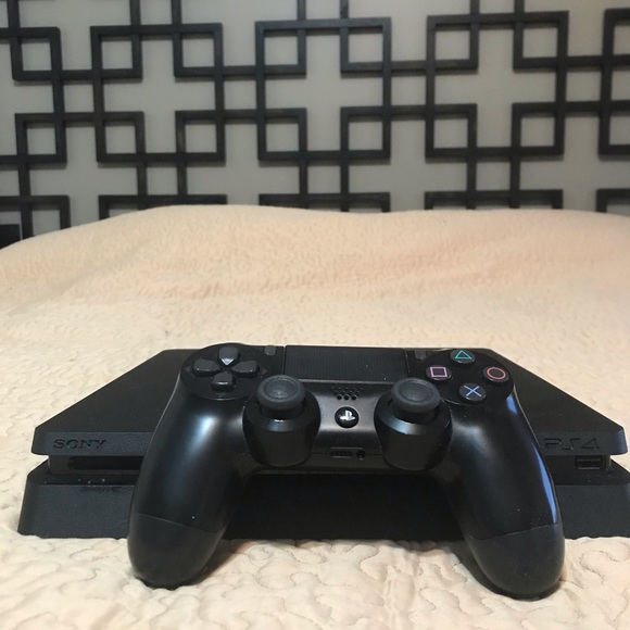 PlayStation 4 slim with controller and cables. - Picture 1 of 5
